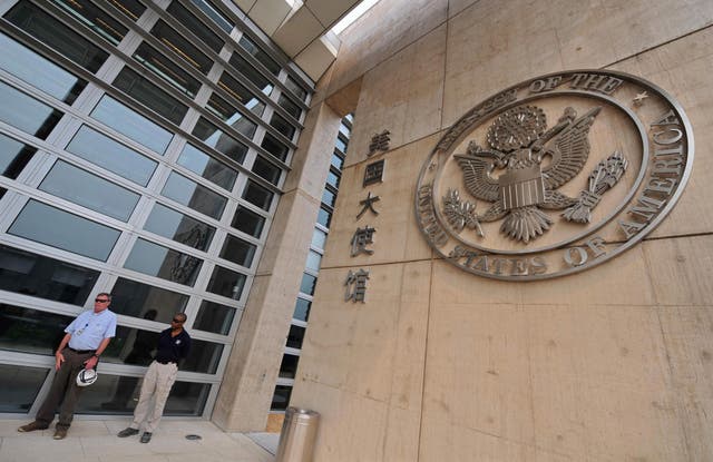 <p>File. Security personnel stand guard in front of US embassy in Beijing</p>