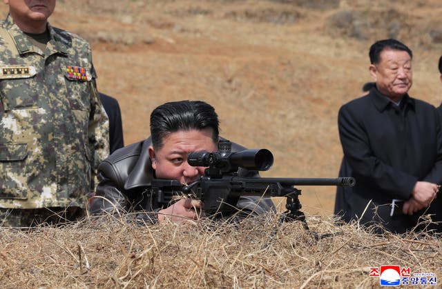 <p>North Korean leader Kim Jong Un test firing a sniper rifle during a visit to the training base of the special operations units of the Korean People's Army at an undisclosed location</p>