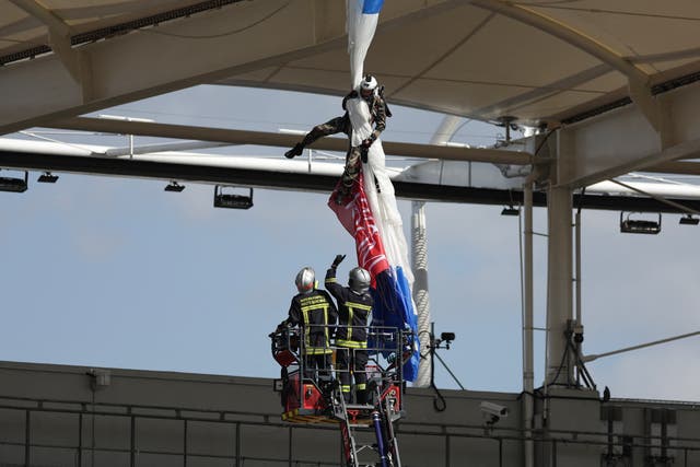 <p>A worrying incident saw the paratrooper stranded hanging from the stadium’s rafters</p>