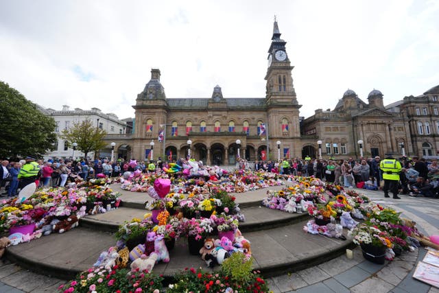 Flowers and tributes outside the Atkinson Art Centre Southport (Owen Humphreys/PA)