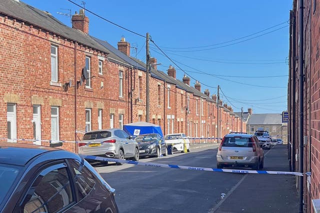 A man aged 60 was shot dead in his own home and two men were caught on camera running away (PA)