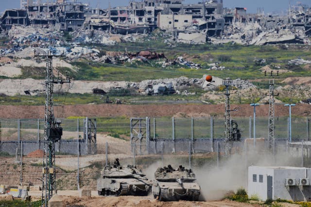 Israeli tanks on the border with the northern Gaza Strip (Ohad Zwigenberg/AP)