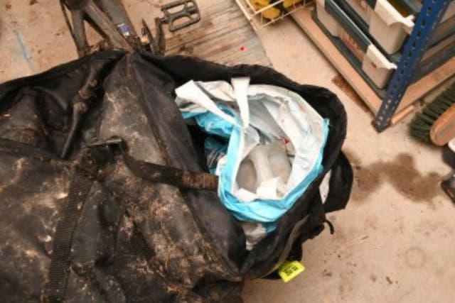 <p>A container of fuel inside Peter Brooks’ cycle pannier</p>