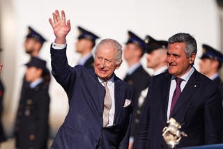 Charles waves as he is greeted in Rome (Aaron Chown/PA)