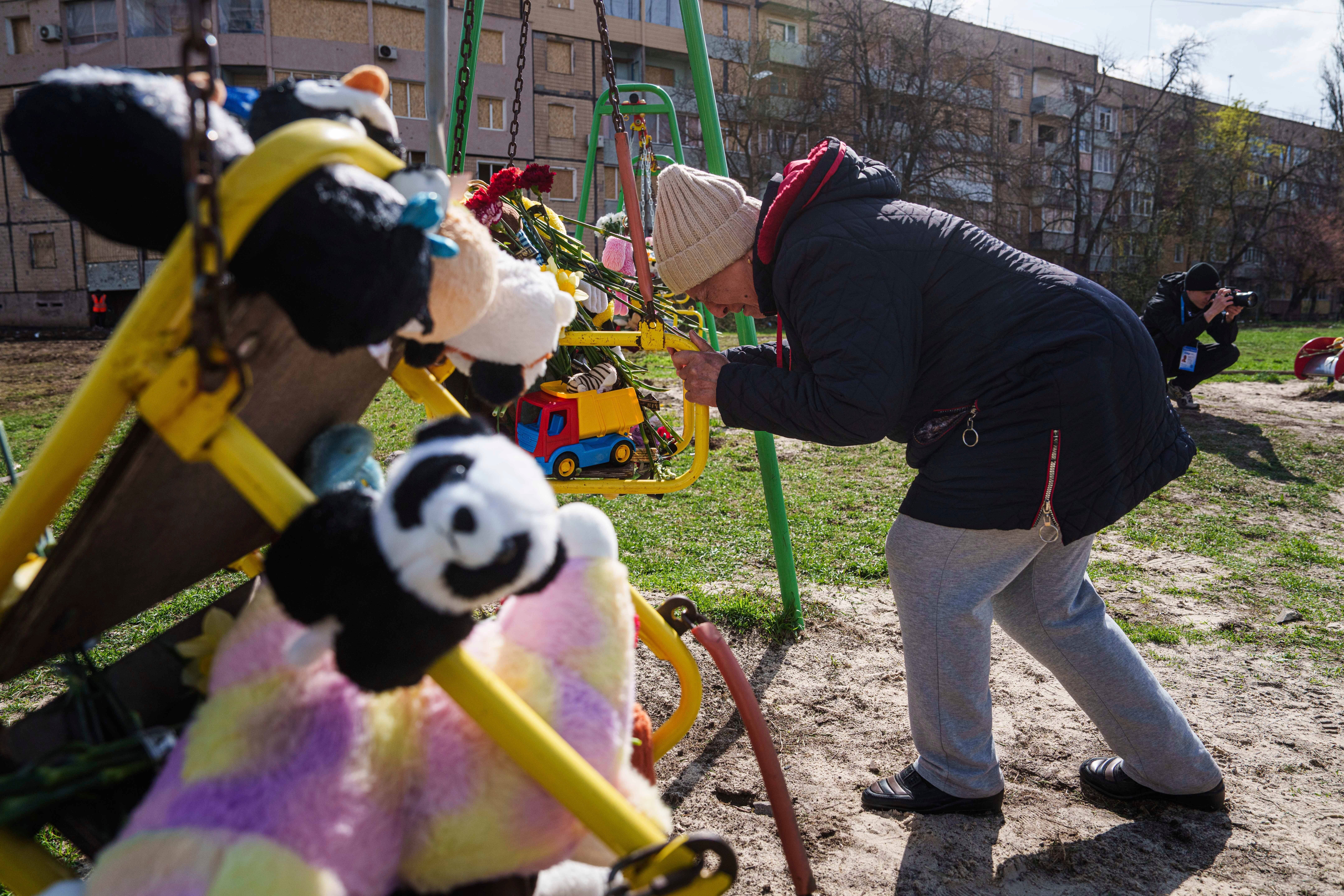 Tributes have been left at the playground where a Russian rocket killed 20 people, including 9 children, in Kryvyi Rih