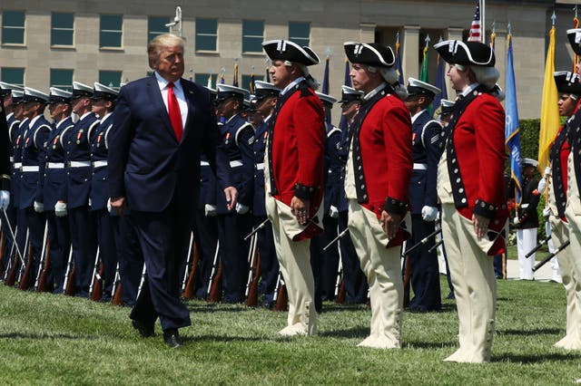 <p>Donald Trump inspects U.S. troops outside the Pentagon in July 2019</p>