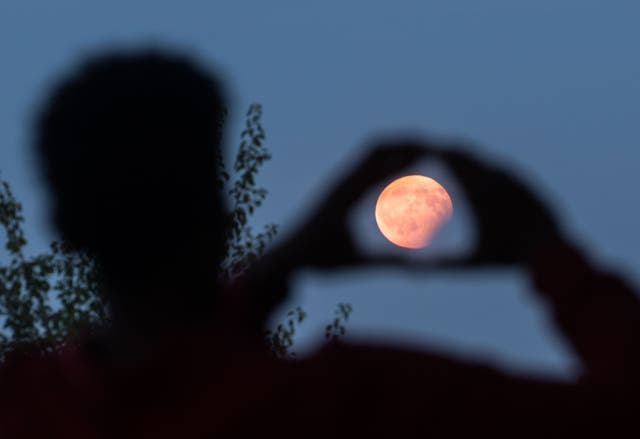<p>A pink moon is on its way. Skywatchers in the U.S. can catch the celestial event this weekend</p>