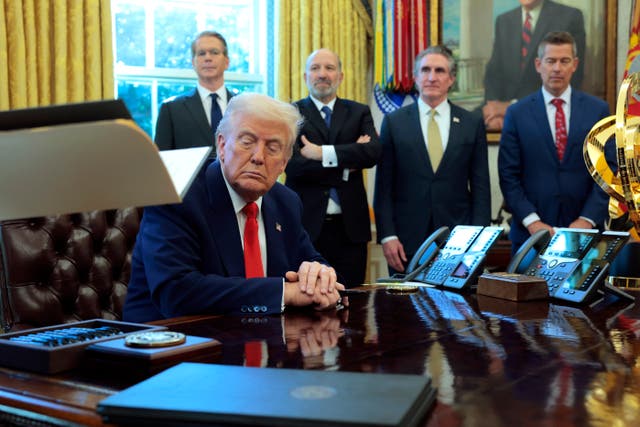 <p>President Donald Trump flanked by members of his economic team including Scott Bessent, Howard Lutnick and Doug Burgum. Bessent poured cold water on the idea Americans could get rebate checks from tariff funds. </p>