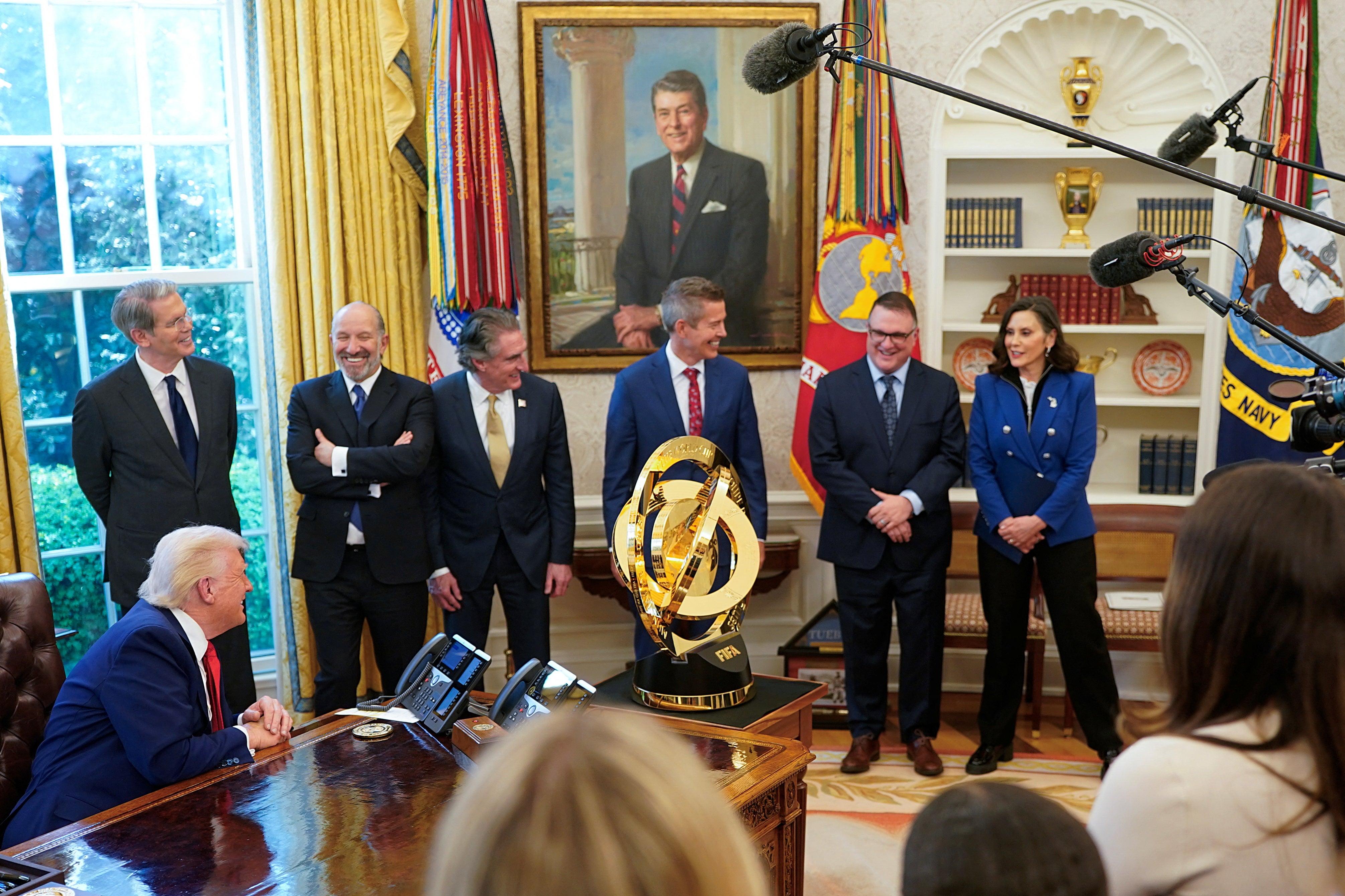 Michigan Governor Gretchen Whitmer stands next to Michigan House Speaker Matt Hall, U.S. Secretary of the Interior Doug Burgum, Commerce Secretary Howard Lutnick, Transportation Secretary Sean Duffy and Secretary of the Treasury Scott Bessent, as President Donald Trump signs executive orders and proclamations