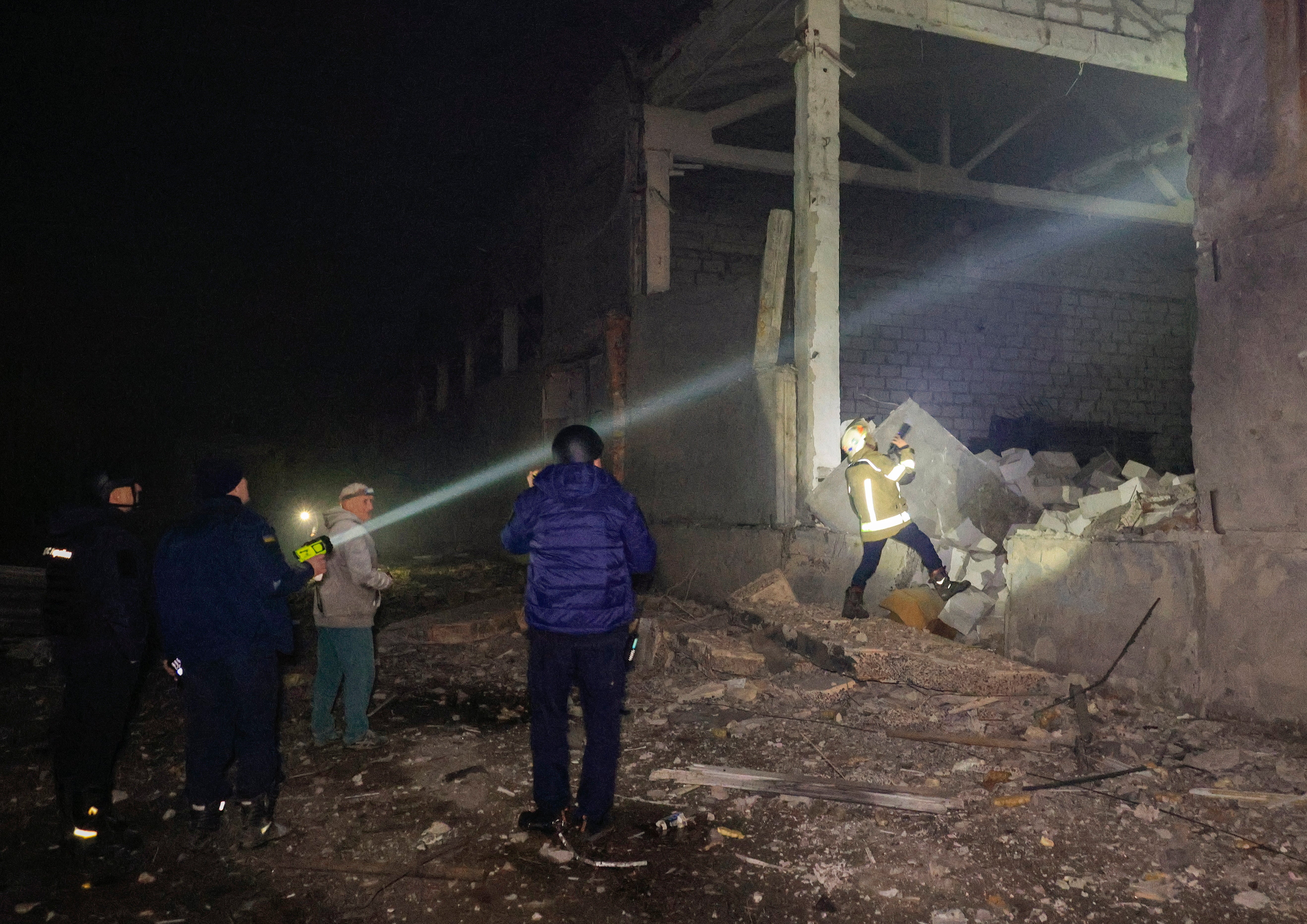 Emergency services inspect damage following Russian drone strikes
