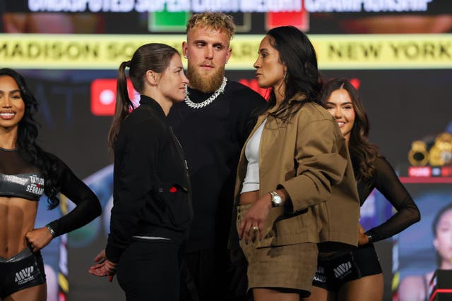 <p>Katie Taylor (left) facing off with Amanda Serrano</p>