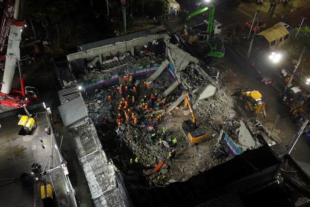 <p>Rescue workers search for bodies at the Jet Set nightclub </p>