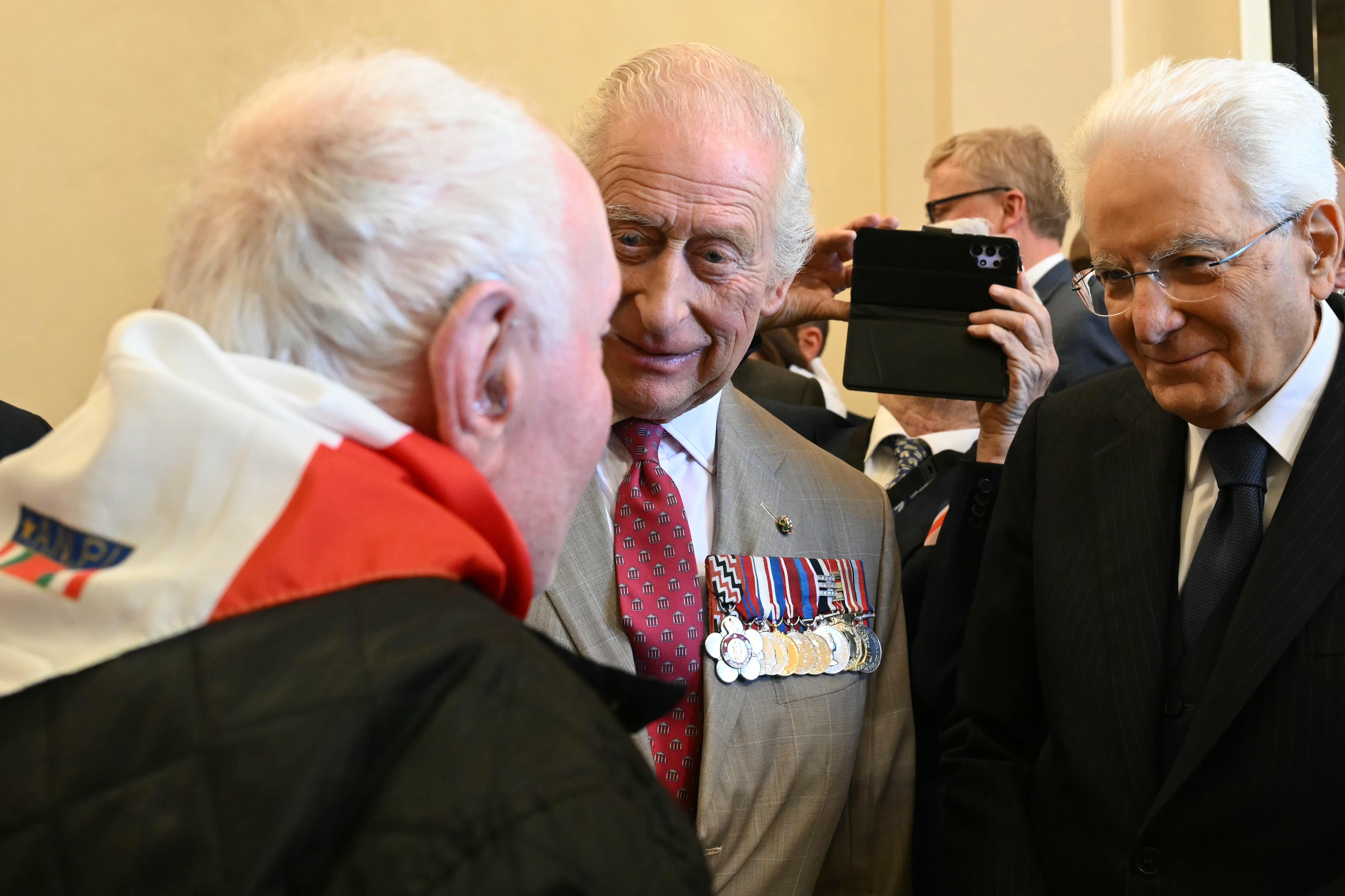 Charles meets with Italian partisans, during a reception at Ravenna Town Hall (Paul Ellis/PA)
