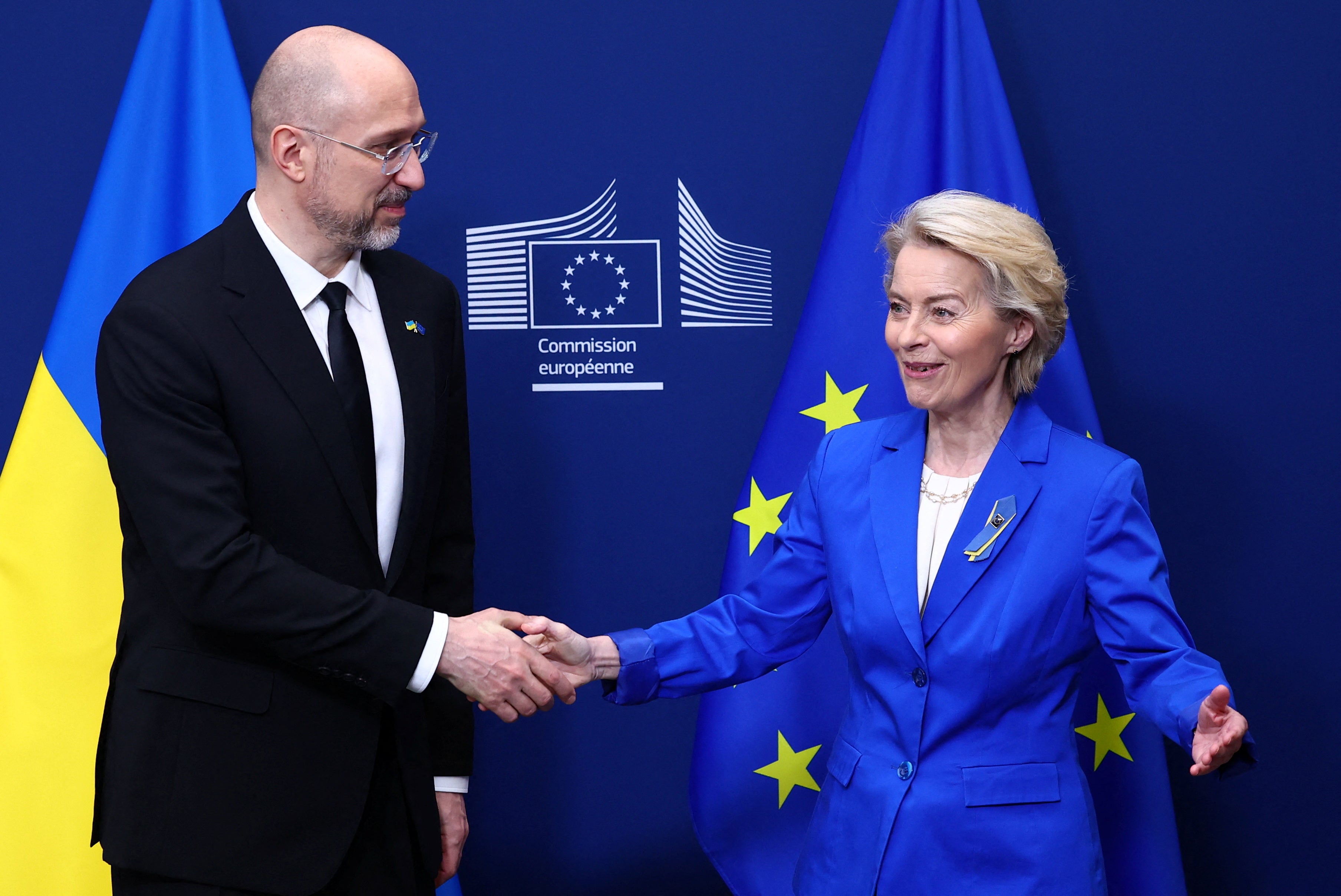 European Commission President Ursula von der Leyen shakes hands with Ukrainian Prime Minister Denys Shmyhal