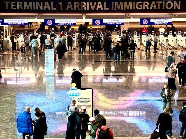<p>Digital checkpoint: Singapore airport has kiosks to clear travellers through passport control</p>