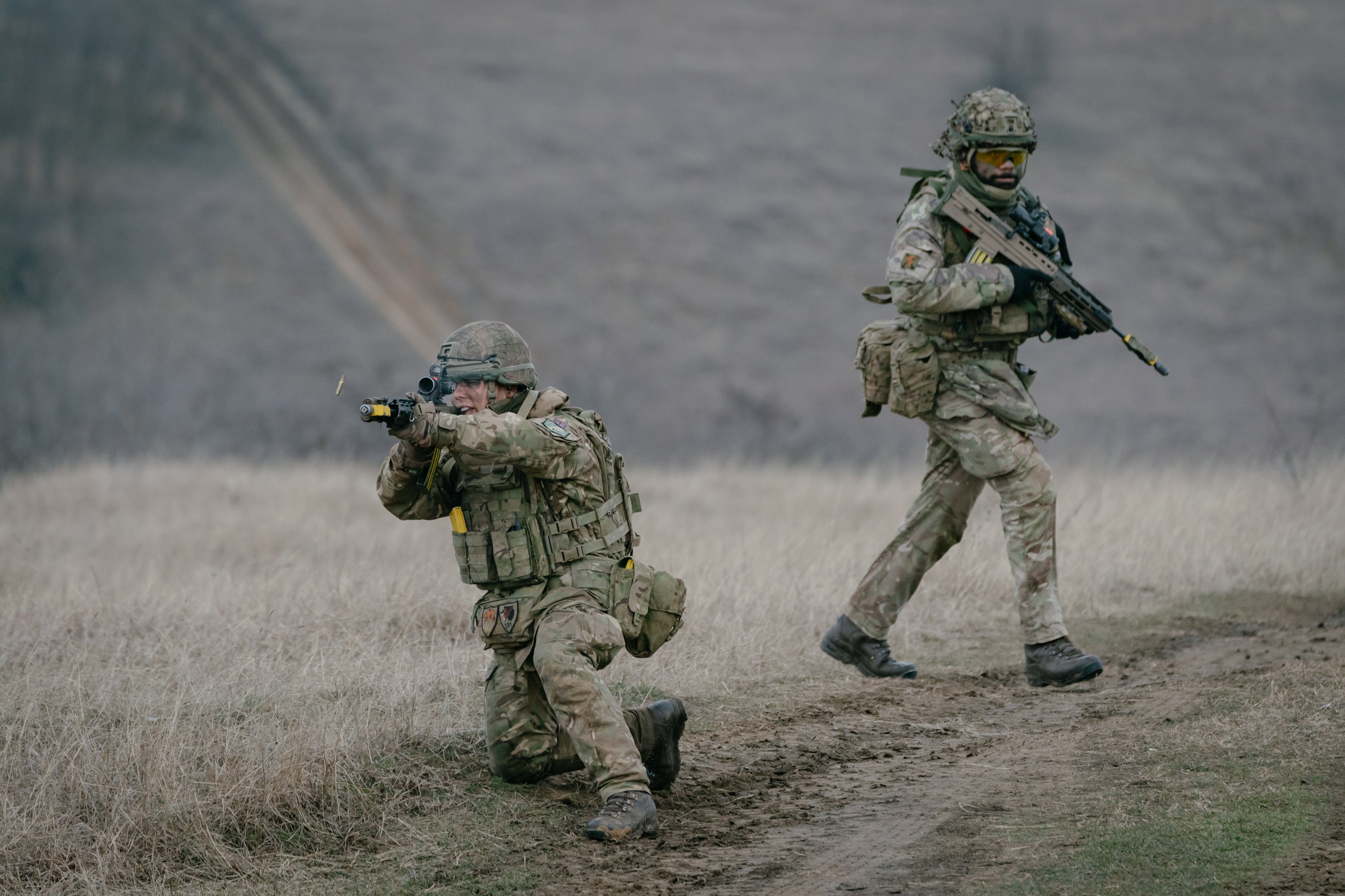 British soldiers practice retreat under fire during an exercise in Smardan, Romania