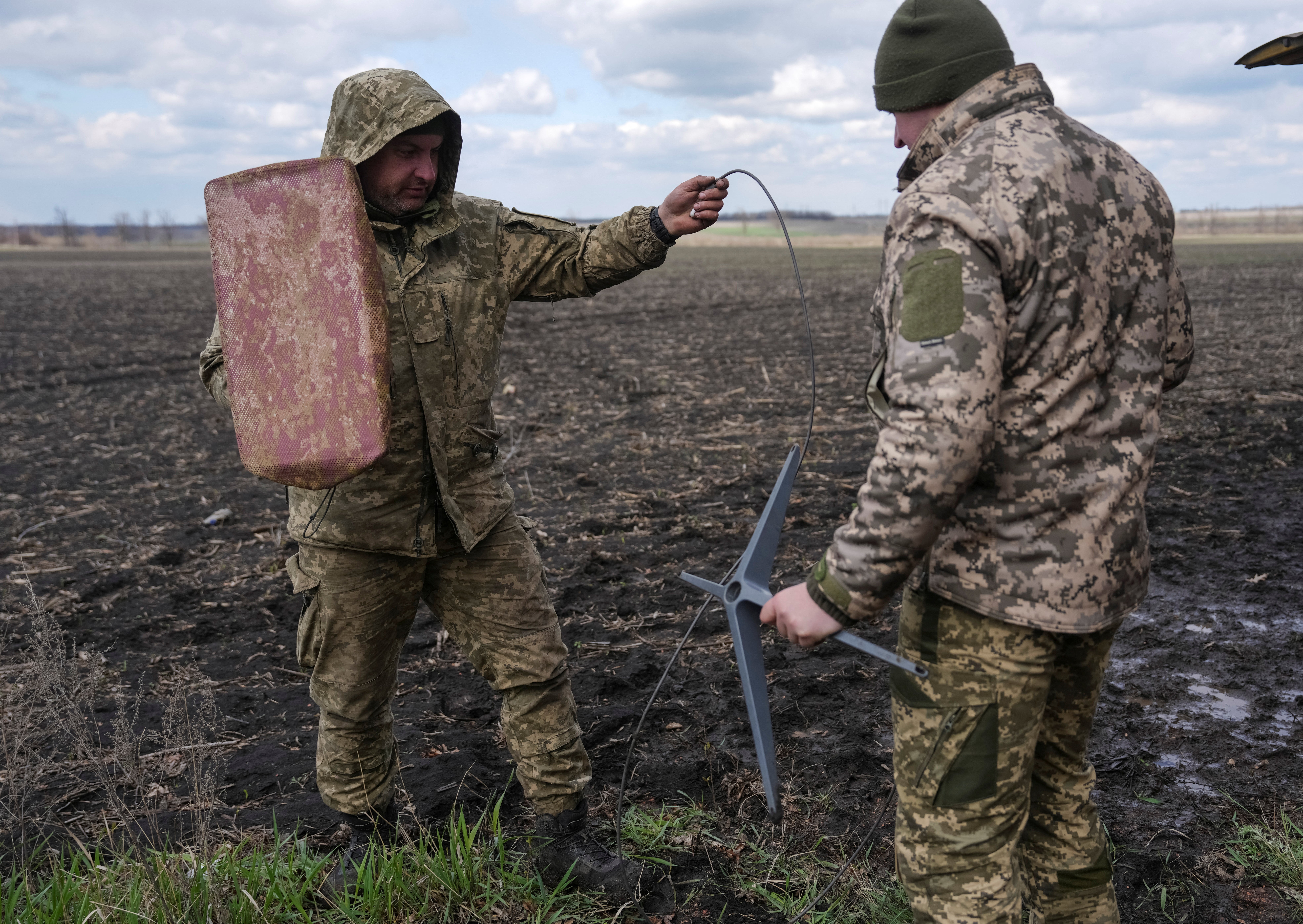 Serviceman of the 68th Olexa Dowbash of Ukraine's armed forces set up a starlink satellite internet system to separate jagger brigade, amidst the attack on Russia on Ukraine, near the frontline city of Pokarovsk in the Doorsk region of Ukraine on April 10, 2025, in Ukraine's Dochark region