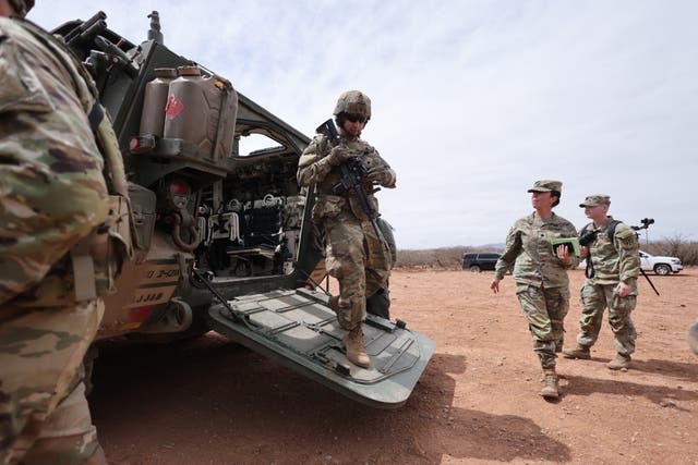 <p>A Stryker armored vehicle platoon is stationed near the fence at the southern U.S. border with Mexico, in Douglas, Arizona, on April 3. President Donald Trump has ordered the military to take control of land near the southern border</p>
