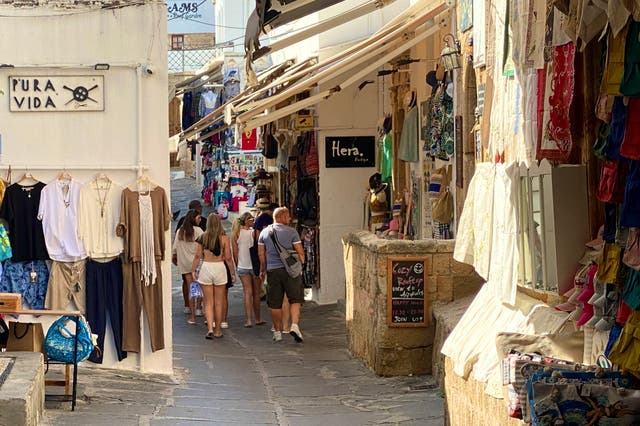 <p>Rhodes scholars: tourists in the twisting, narrow lanes of Lindos</p>