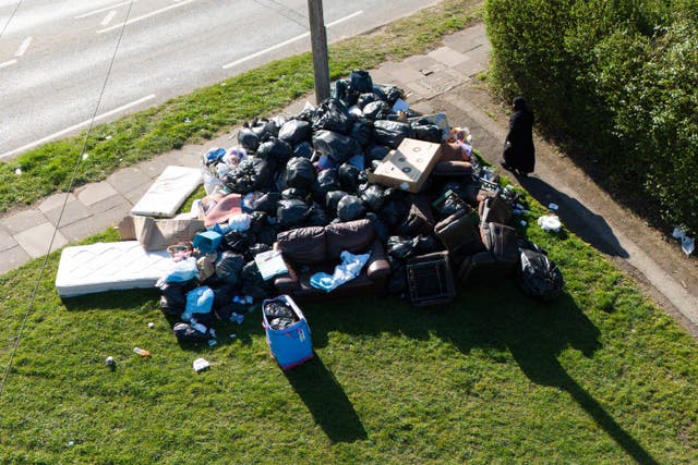 Furniture and uncollected refuse bags in Yardley, east Birmingham (Jacob King/PA)