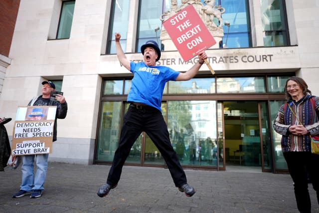 <p>The anti-Brexit protester celebrated outside Westminster Magistrates’ Court on Monday</p>