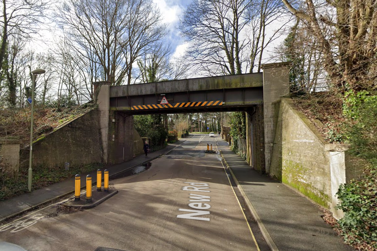 Police probe after mannequin hung from bridge with bag over its head and hands tied