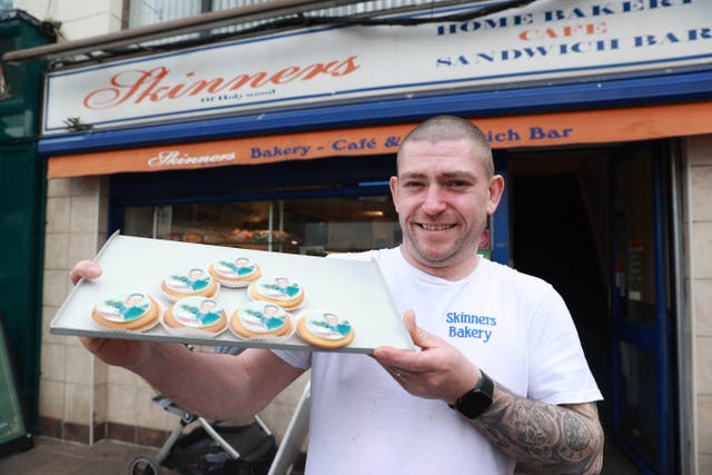 Graham McMorris of Skinners Bakery in Holywood, Co Down, with his German biscuits with an image of Rory McIlroy’s face printed onto sugar paper, to celebrate his victory in the Masters golf tournament (Liam McBurney/PA)