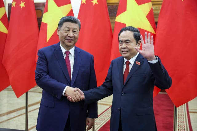 <p>Chinese president Xi Jinping with Vietnam’s National Assembly chairman Tran Thanh Man in Hanoi on 14 April 2025</p>