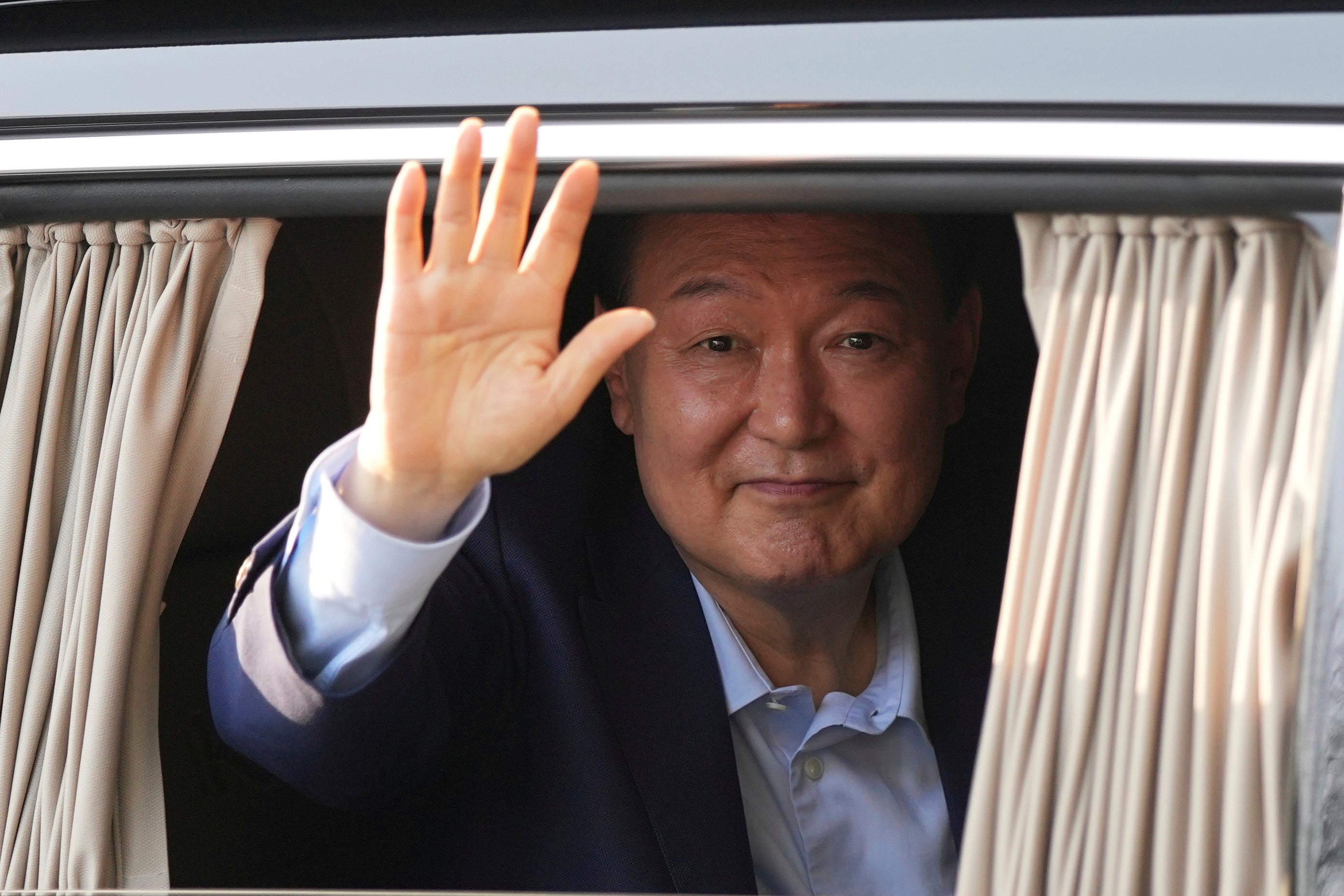 <p>File. Ousted South Korean President Yoon Suk Yeol waves upon his arrival at the private residence in Seoul, South Korea, on 11 April 2025</p>