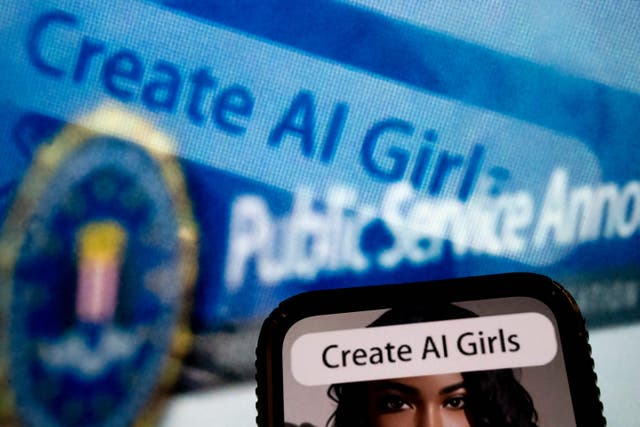 <p>This photo illustration created on 18 July 2023, in Washington, DC, shows an advertisement to create AI girls reflected in a public service announcement issued by the FBI regarding malicious manipulation of pictures and videos</p>