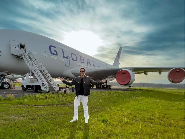 <p>Taking off: James Asquith, founder of Global Airlines, in front of an Airbus A380</p>