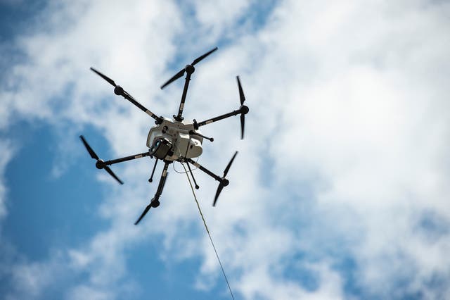 <p>A tethered drone  shows off its unlimited flight time at an event in Boston, Massachusetts</p>