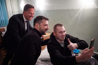 Ukraine president Volodymyr Zelensky and Nato secretary general Mark Rutte pose for a selfie photo with a wounded Ukrainian serviceman at a hospital in Odesa