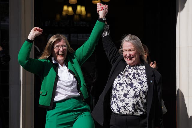 Susan Smith, left, and Marion Calder from For Women Scotland celebrate the verdict outside the Supreme Court (Lucy North/PA)