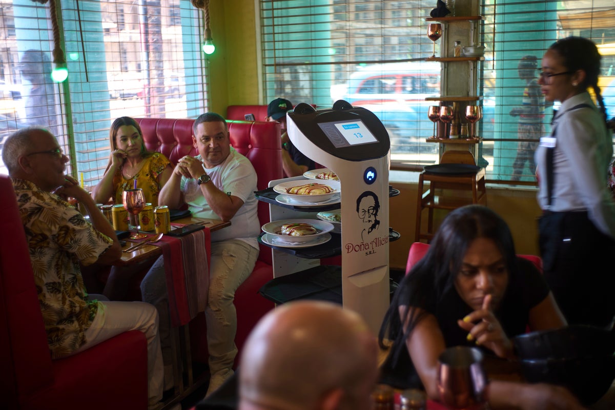 A restaurant in Havana defies Cuba's tech struggles with digital menus and a robot waitress