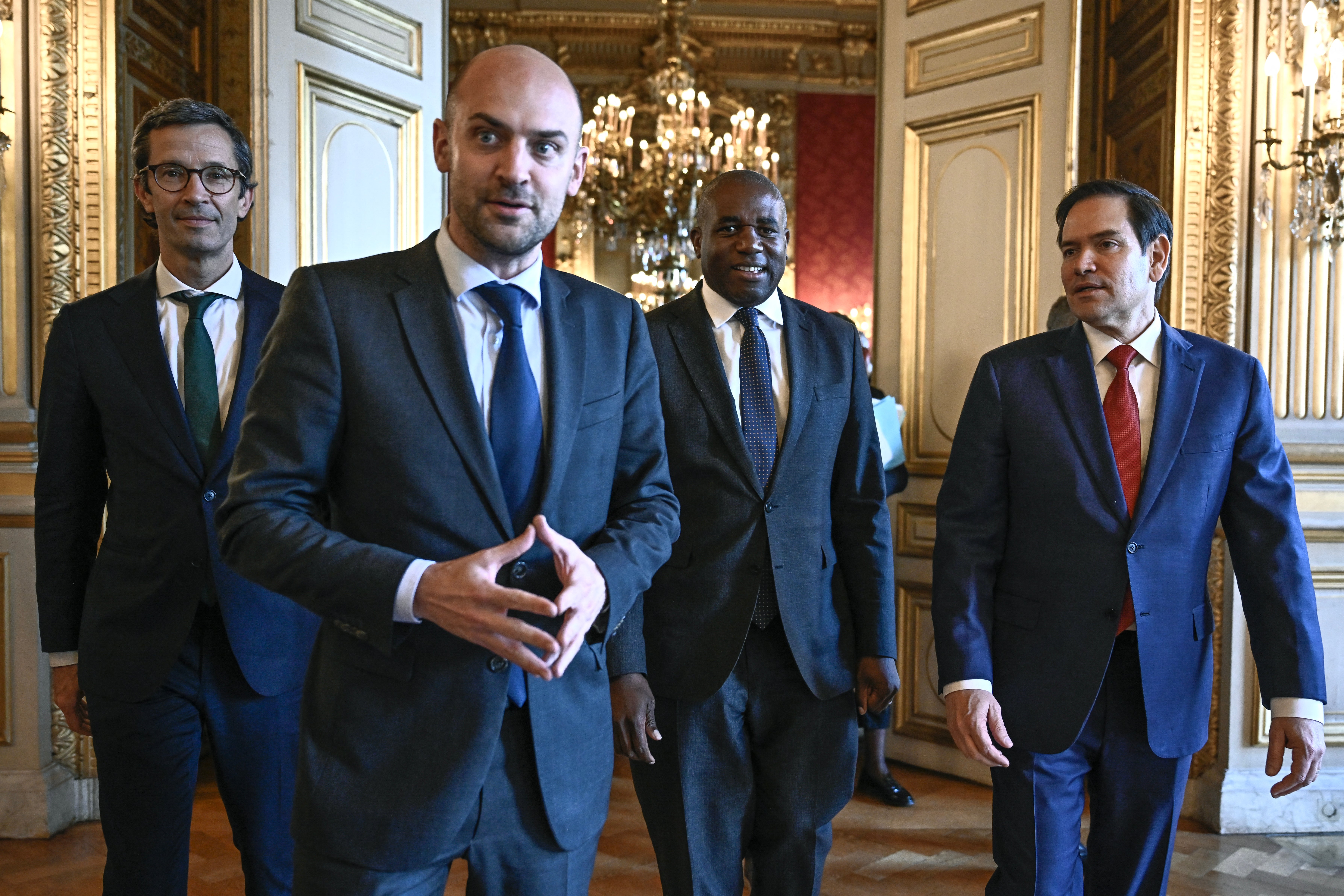 France's minister for Europe and foreign affairs Jean-Noel Barrot, Britain's foreign secretary David Lammy and US secretary of state Marco Rubio react upon their arrival for a meeting in Paris