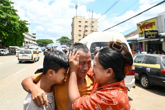 <p>Relatives celebrate with a prisoner released from Insein prison to commemorate the Buddhist New Year in Yangon on 17 April 2025</p>