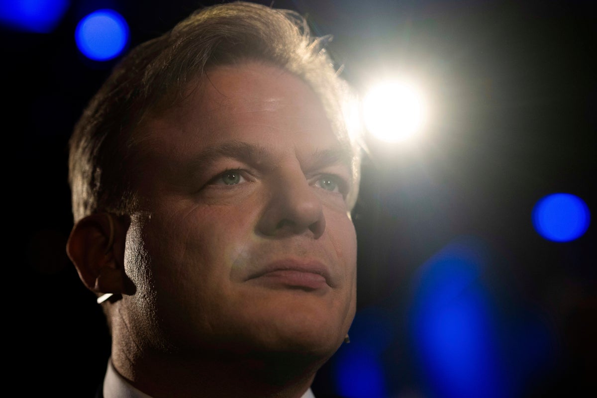 Dutch leader of party in fragile ruling coalition quits politics, citing burnout