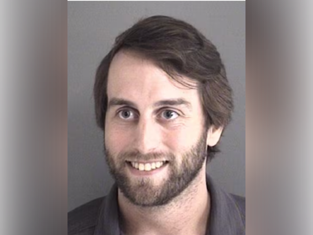 <p>Tanner Bandy was arrested for stalking and threatening to commit a mass shooting at the Iowa State University commencement ceremony next month, authorities announced</p>