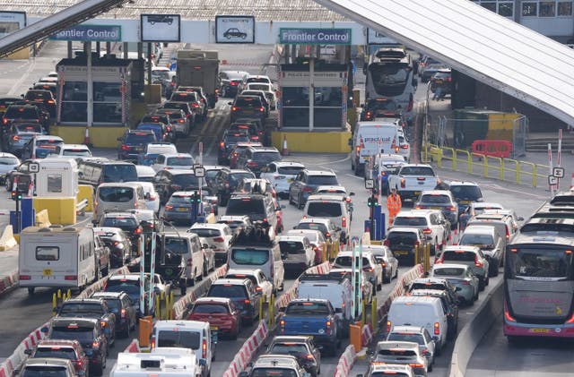 <p>Cars queue at check-in to board ferries at the Port of Dover in Kent</p>