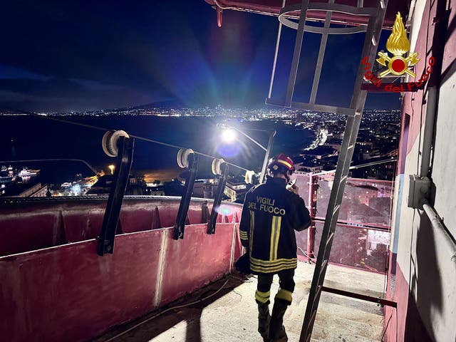 <p>Firefighters working on the site of the Monte Faito cable car collapse </p>