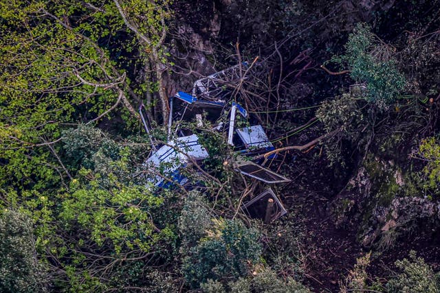 <p>Aerial view of the crashed gondola of a cable car</p>
