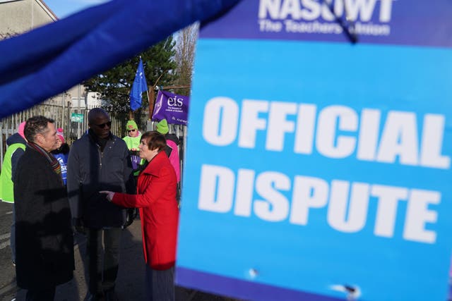 Mike Corbett, National Association of Schoolmasters Union of Women Teachers (NASUWT) Official for Scotland, Dr Patrick Roach, general secretary of the NASUWT, and Scottish Trades Union Congress (STUC) general secretary Roz Foyer, with teachers on the picket line outside St. Andrew’s RC Secondary School in Glasgow, as they take strike action in a dispute over pay (Andrew Milligan/PA)