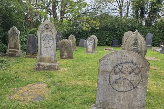 Graffiti daubed on gravestones at St James Church in Leyland, near Preston (Paul Wharton-Hardman/PA)
