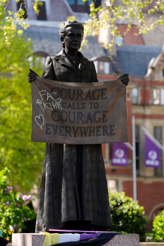 <p>Graffiti left on statues in Parliament Square</p>