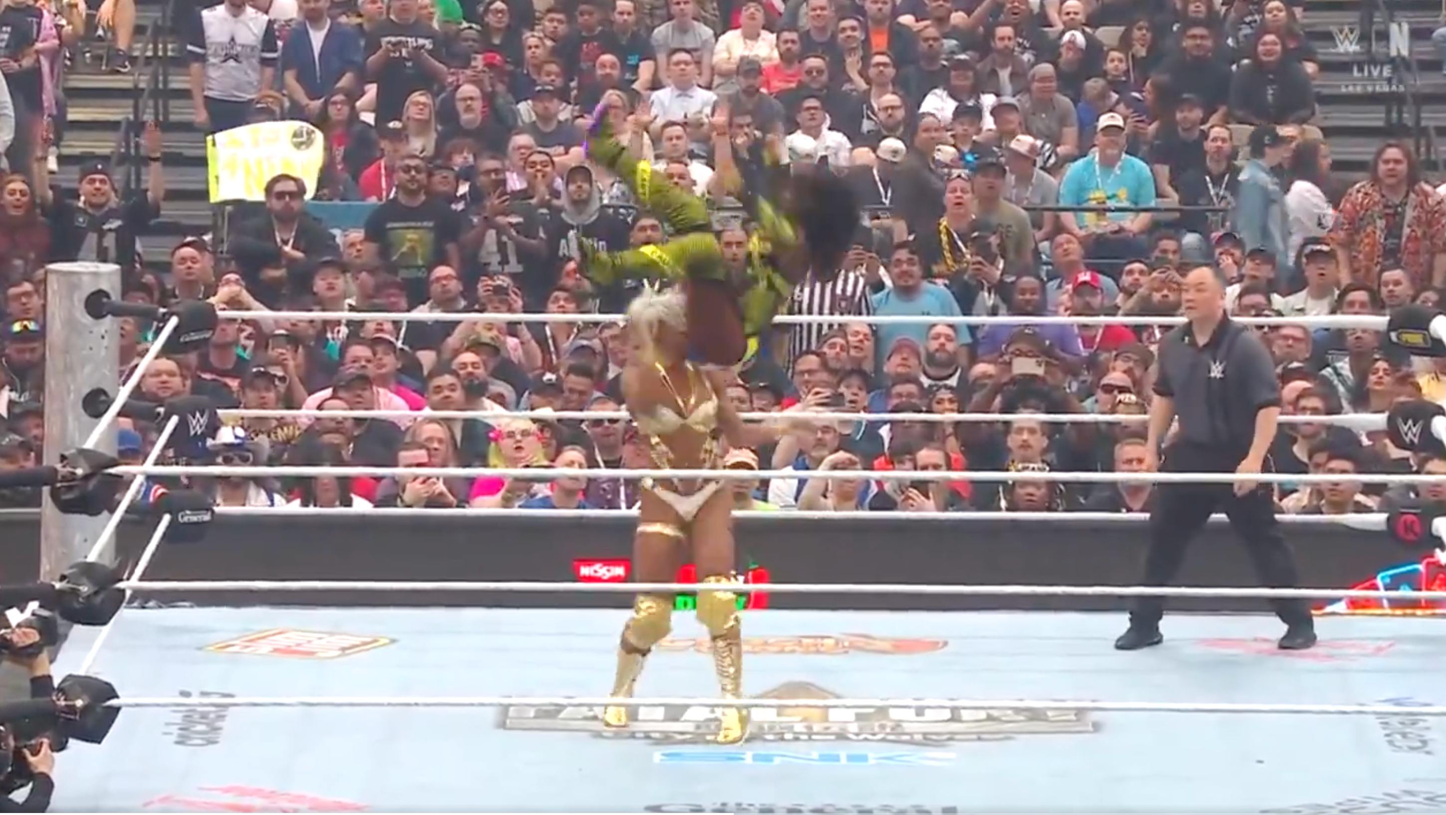 Cargill with a powerbomb on Naomi