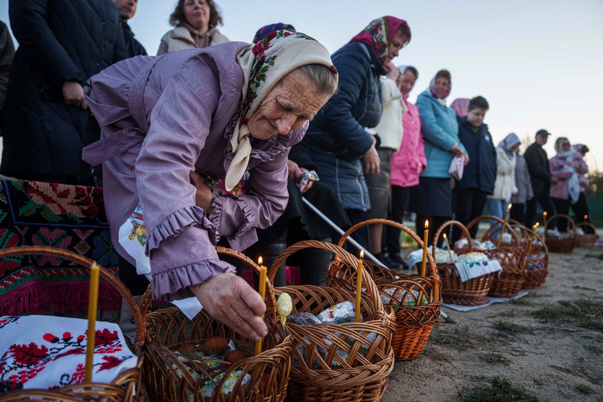 Ukrainians gather together to mark Easter as Zelensky accuses Russia of breaking Putin’s ‘truce’