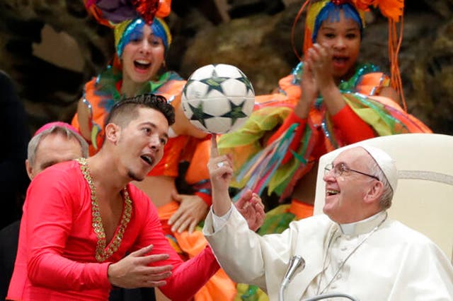 <p>Pope Francis twirls a soccer ball he was presented by a member of the Circus of Cuba, during his weekly general audience in the Pope Paul VI hall, at the Vatican, Wednesday, Jan. 2, 2019. (AP Photo/Andrew Medichini, file)</p>