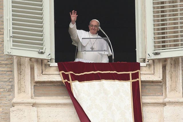 Pope Francis delivering his Angelus prayer from the window of his studio overlooking St Peter’s Square, at the Vatican (Niall Carson/PA)