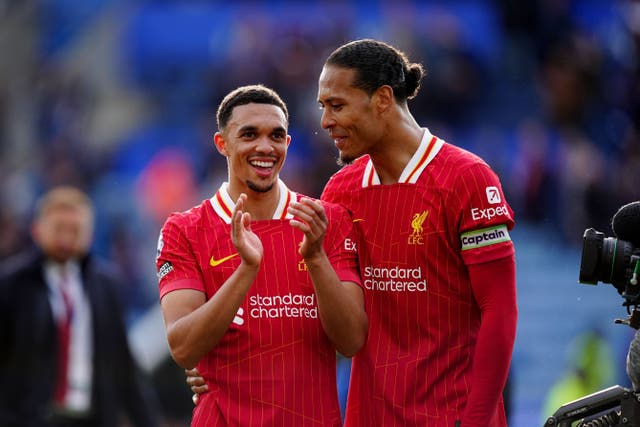 <p>Liverpool’s Trent Alexander-Arnold (left) and Virgil van Dijk (right) celebrate at the final whistle (Mike Egerton/PA)</p>